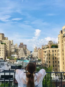 niki looks out at the new york city skyline