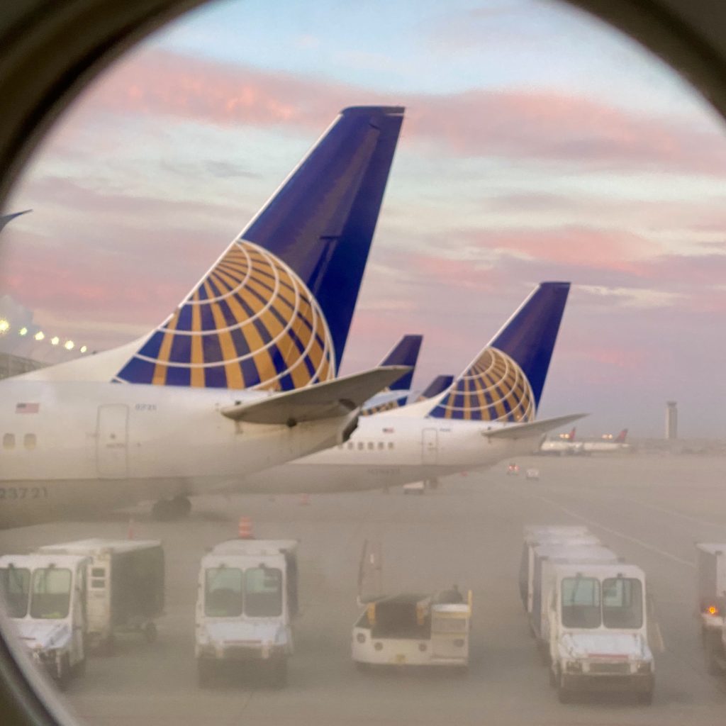 things flight attendants wish passengers knew: airplane tails at sunset