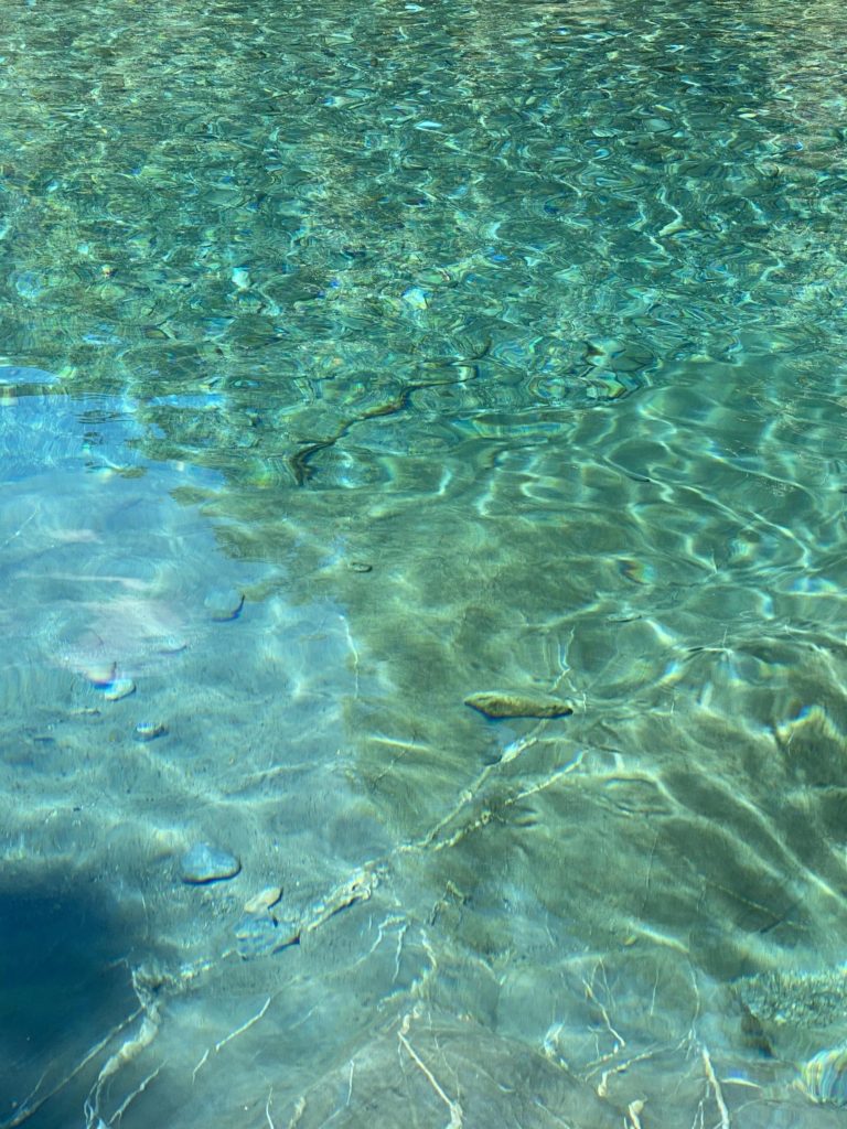 very blue and clear water