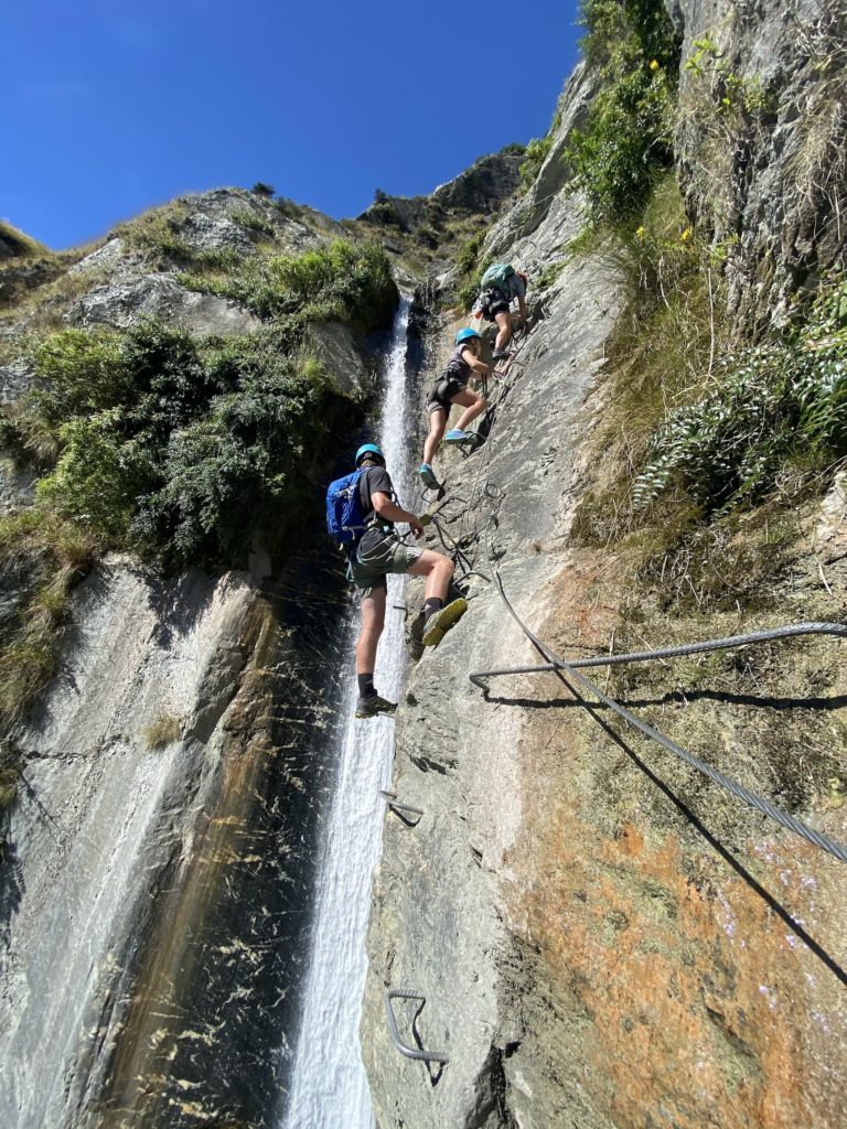 via ferrata wanaka: ropes and cables with a waterfall in the background
