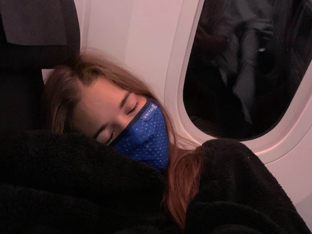 niki sleeps on the airplane