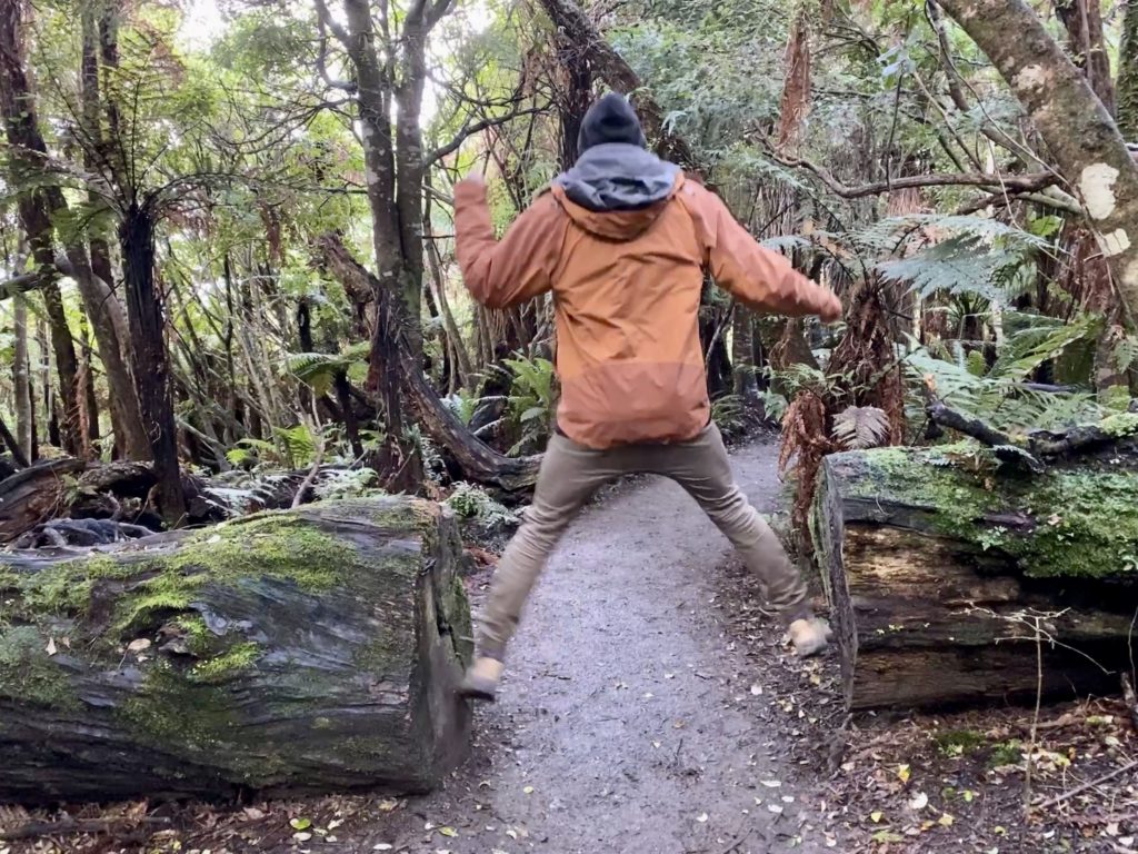Ben jumps between a fallen log that has been cut in half