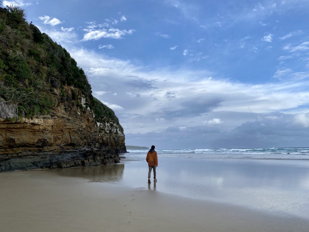 Ben walks along Waipati Beach, Cathedral Caves