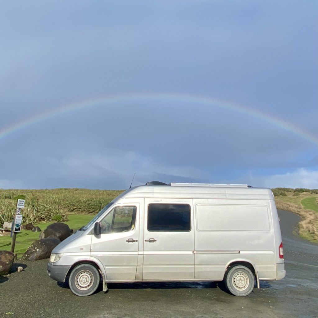 The van with a rainbow behind it, the Catlins region, New Zealand