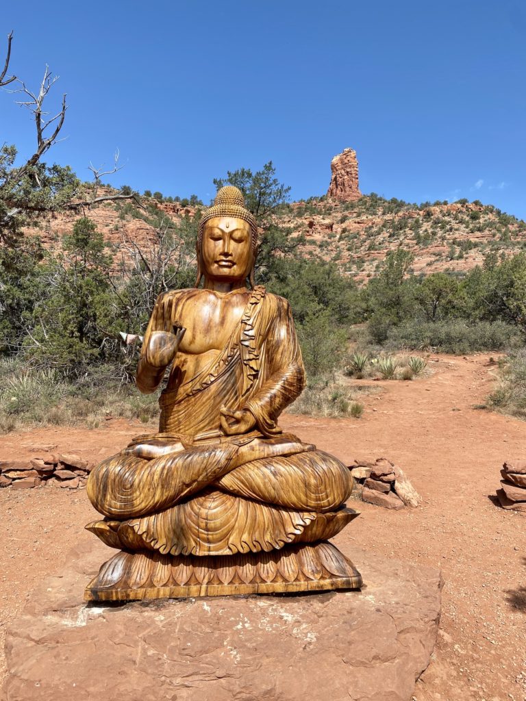 Golden statue of Buddha at Amitabha Stupa and Peace Park