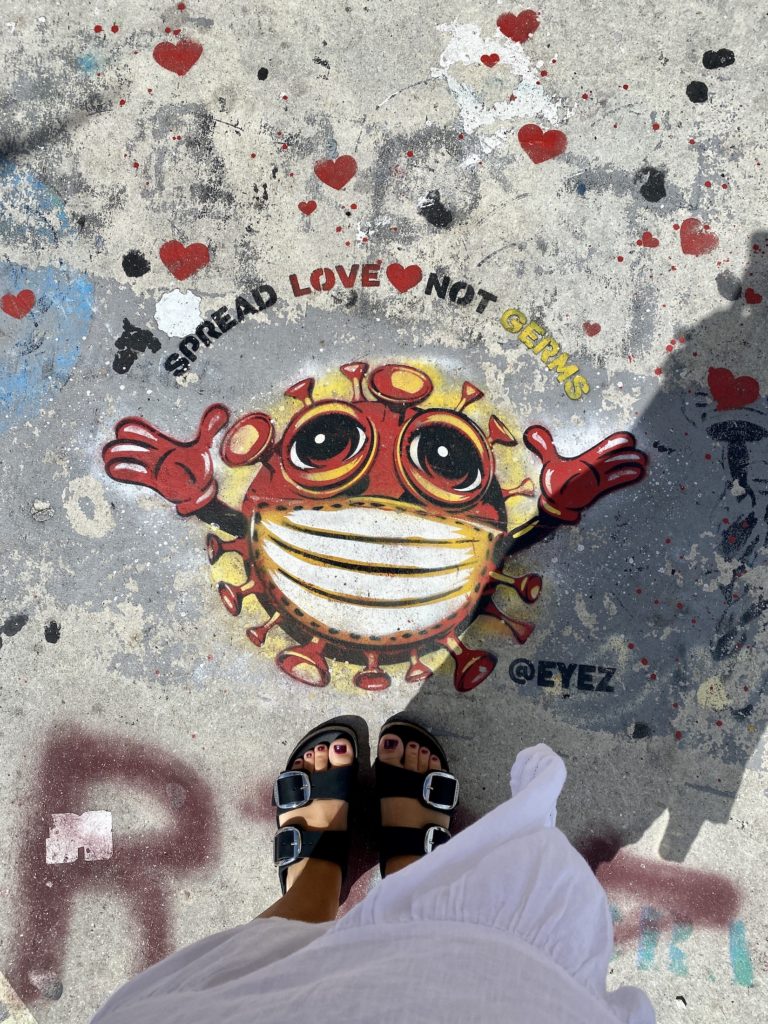 Street art on the ground at Wynwood, Miami: "Spread love not germs"