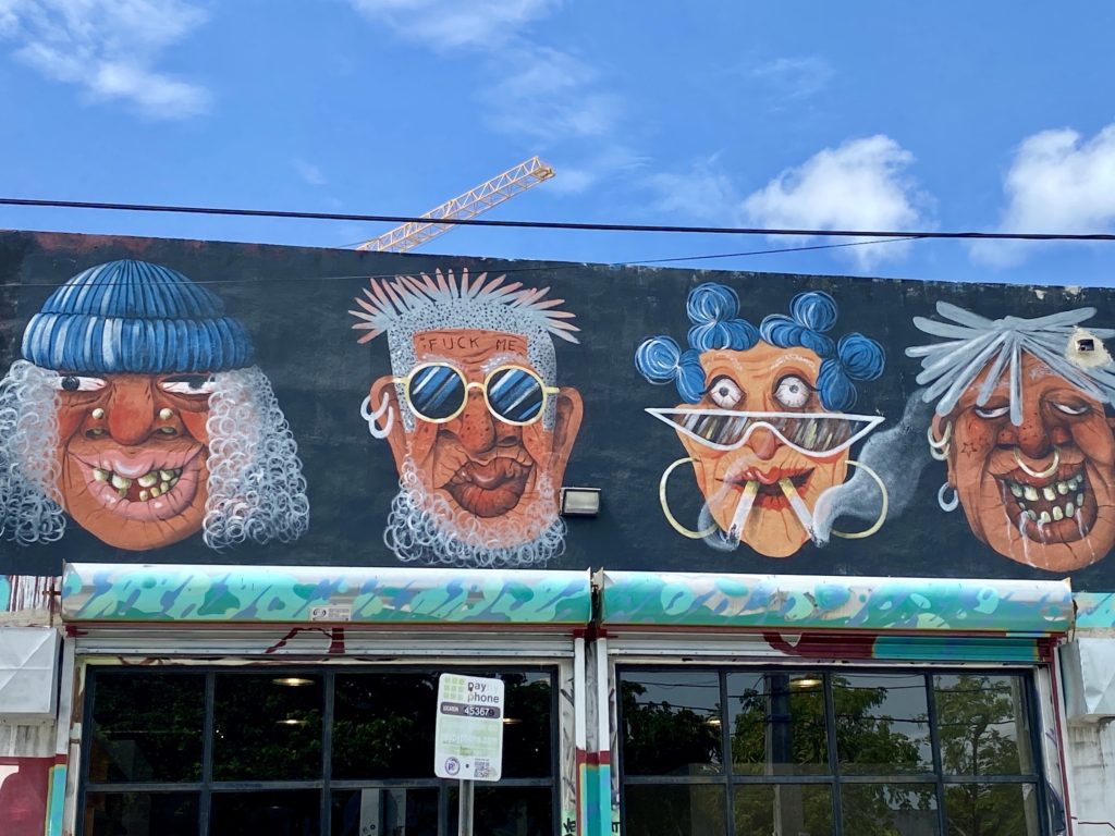 Street art of four heads in Wynwood, Miami