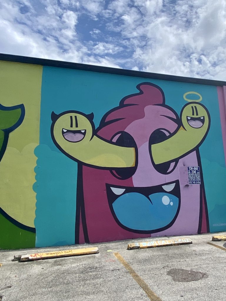 Street art of a cartoon figure with worms in his eyes, Miami