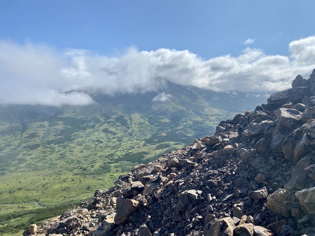 Rocky slope of Flattop Mountain with other mountains in the background