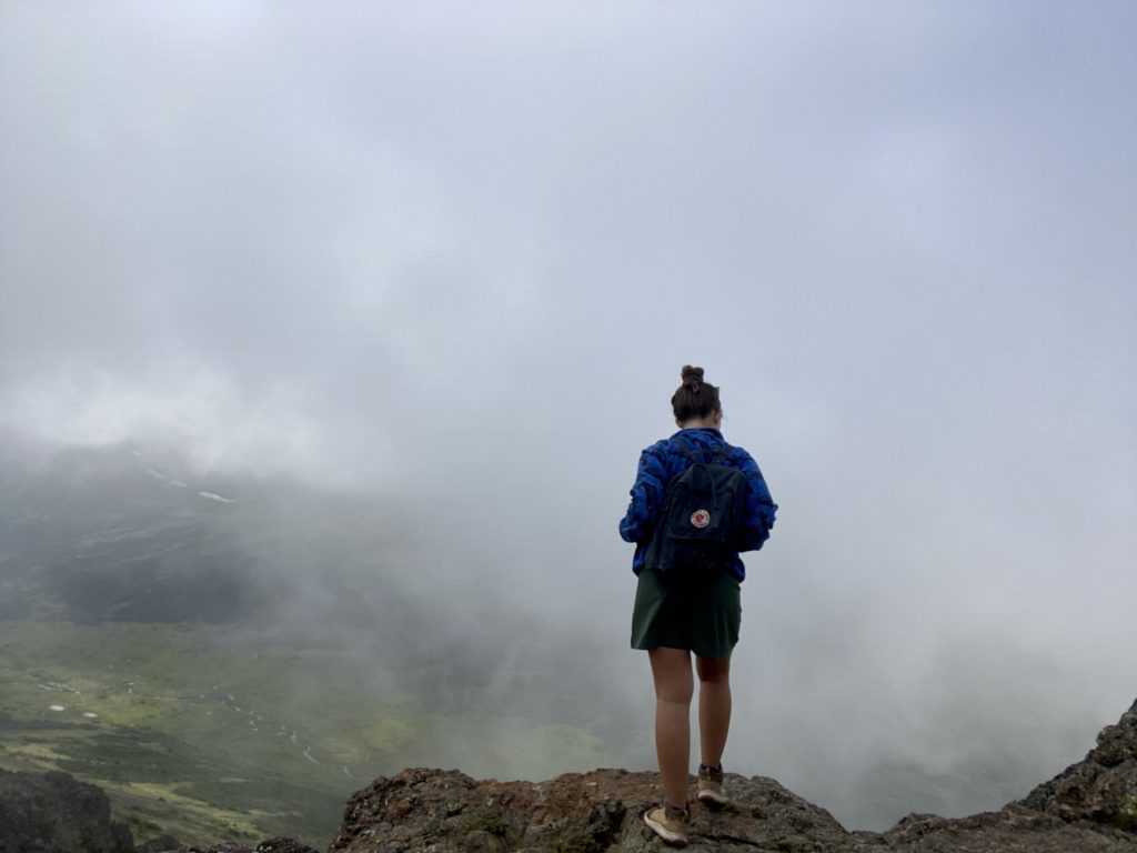 Anchorage travel guide: Niki stands at the summit of Flattop Mountain trail hike