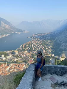 Niki stands on the Kotor Walls, Kotor, Montenegro