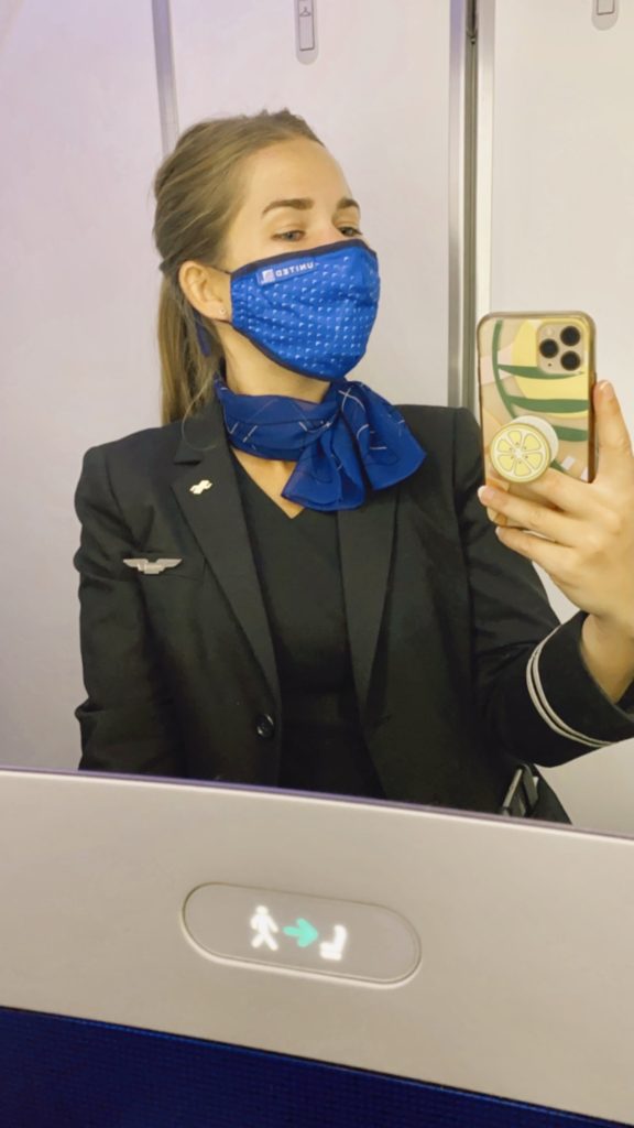 One Second Everyday in 2021: Niki takes a selfie in her flight attendant uniform 
