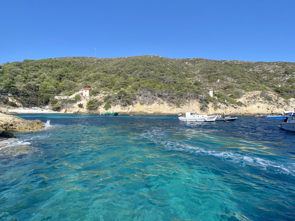 Blue water and boats on Vis island, Croatia