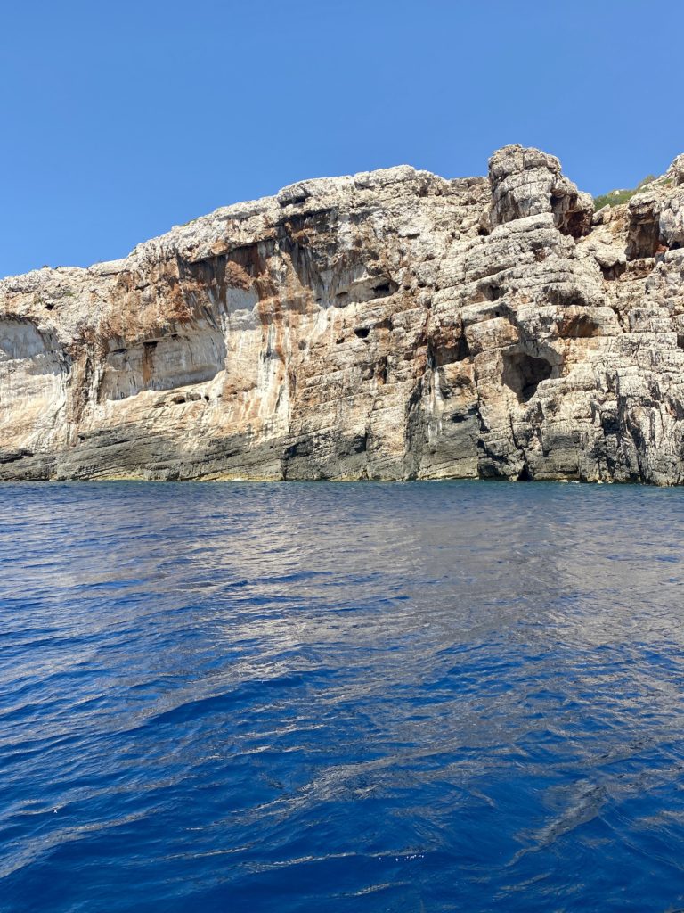 Blue water and rock formations on Vis Island, Croatia