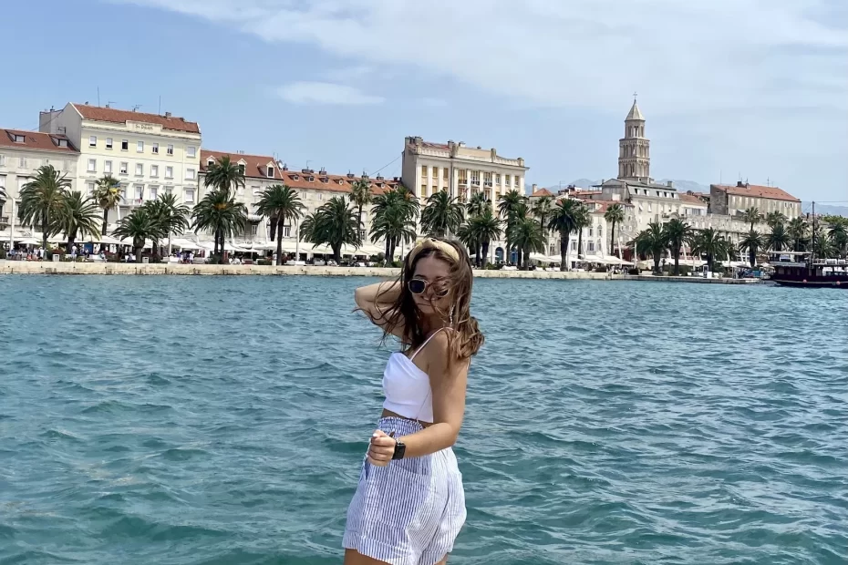 Niki stands in front of the Riva boardwalk, Split, Croatia