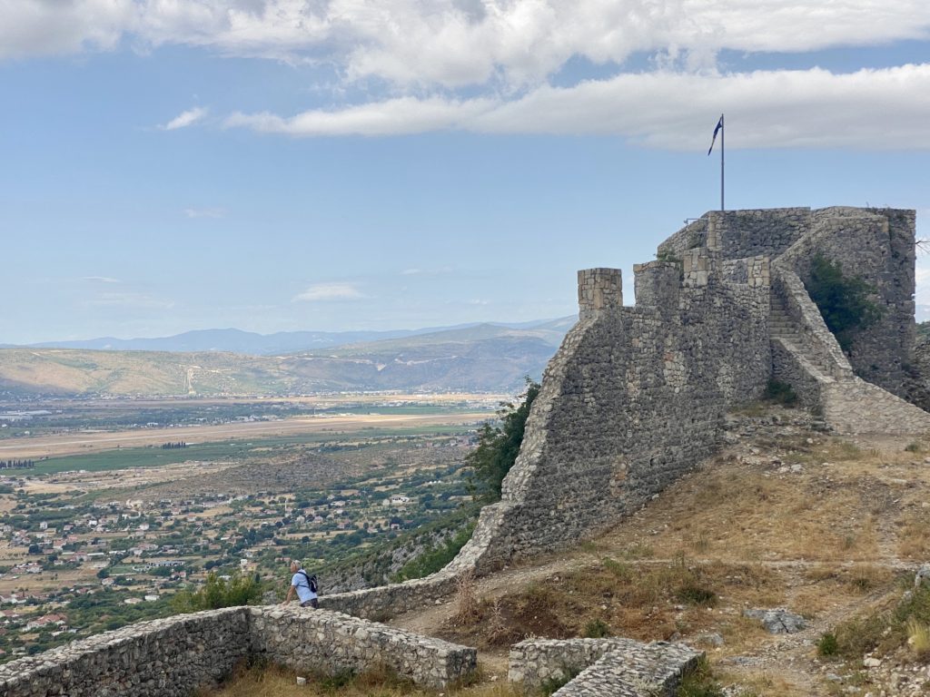 Crumbled ruins of Old Town Fortress walls with an overlook of the Bosnian countryside