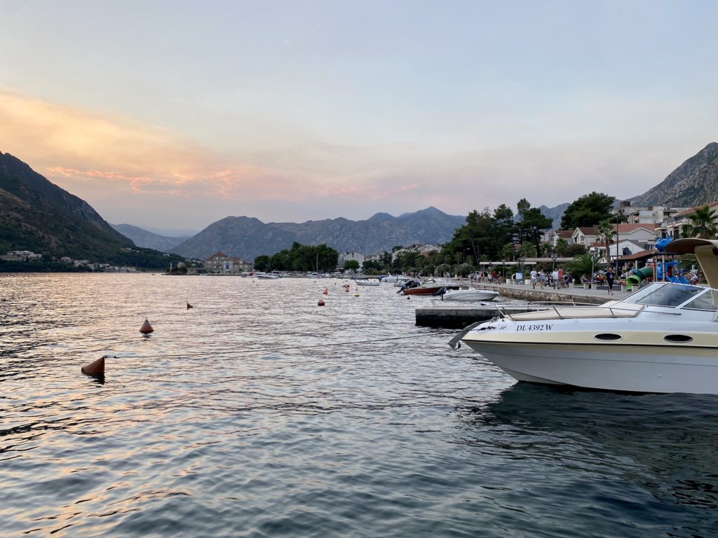 Kotor travel guide: Sunset, boats, and mountains, Bay of Kotor, Montenegro