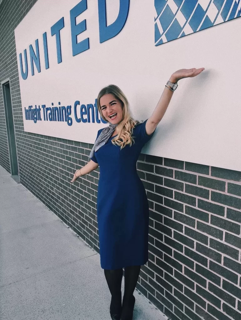 Niki stands in front of the United flight attendant initial training building in Houston, Texas