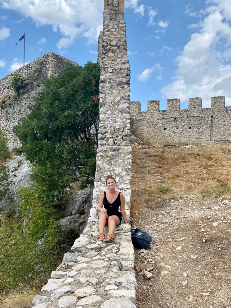 Niki sits on the ruined walls of Old Town Blagaj Fortress