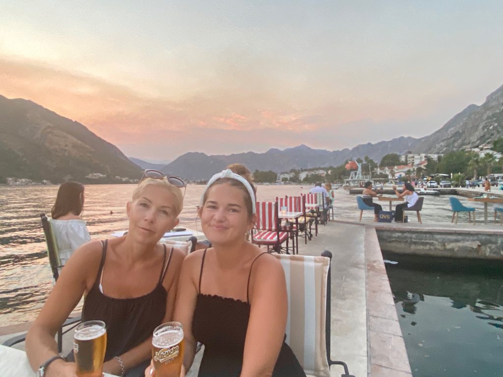 Kotor travel guide: Niki and Lucy eat at a restaurant on the Bay of Kotor, Montenegro