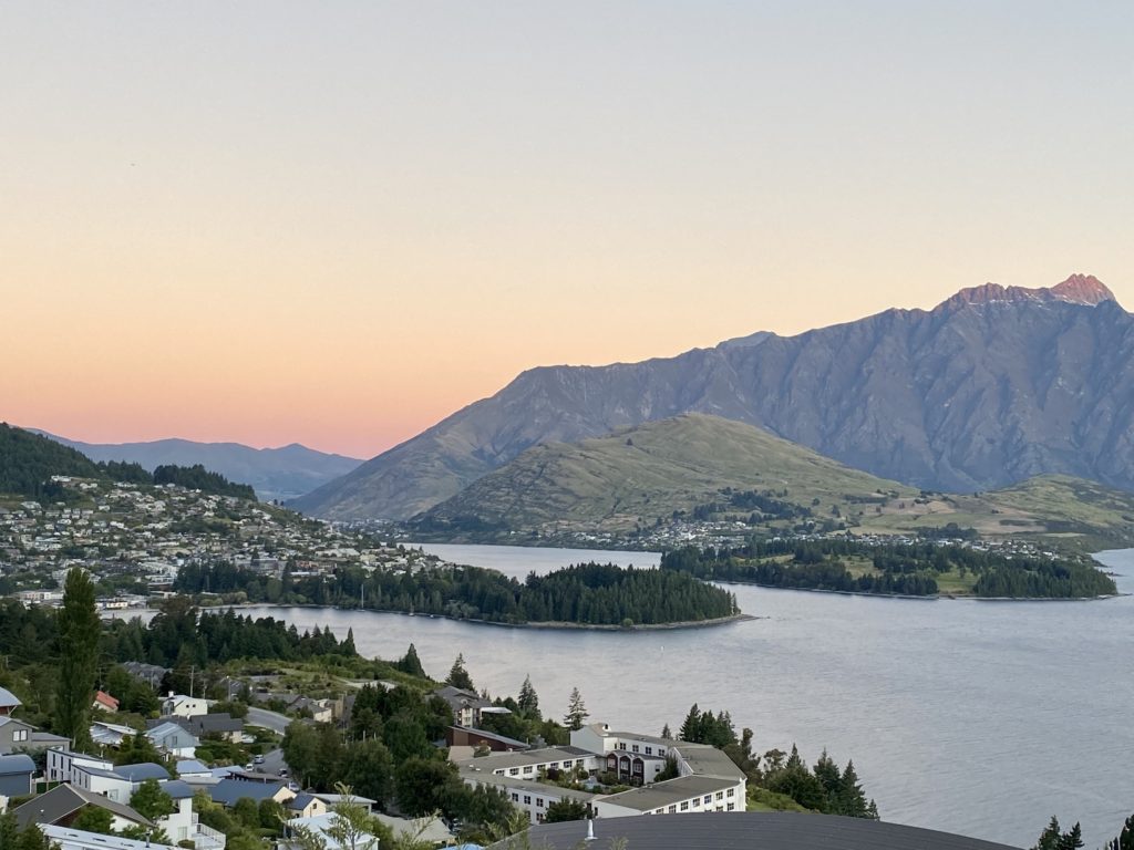 View of Queenstown and surrounding mountains at sunset, New Zealand