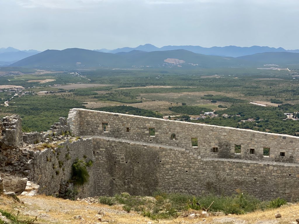 Balkans road trip itinerary: Ruined fortress and view of Ljubuski, Bosnia & Herzegovina