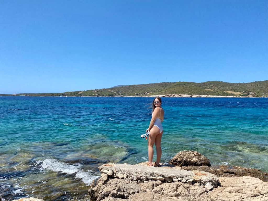 Niki stands in front of ocean, Vis Island, Croatia
