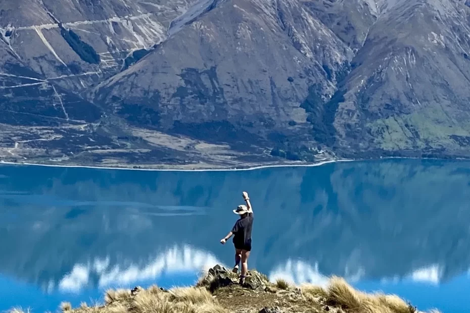 Niki stands on top of Ben Ohau, the summit of the Greta Track outside of Twizel, New Zealand