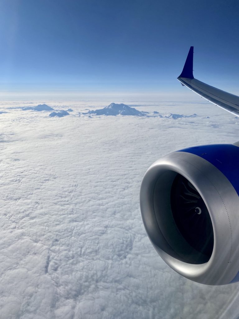 How to travel more: Airplane wing over Denali (Mt McKinley), Alaska