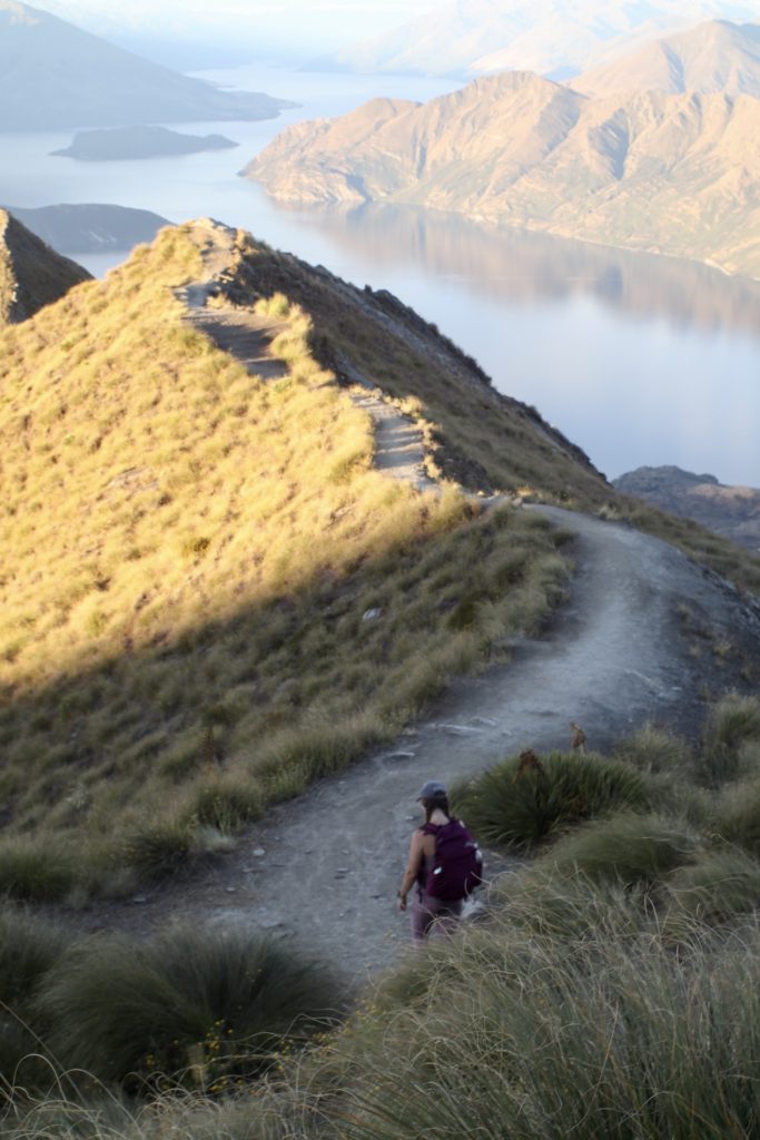 Niki walks up to Roys Peak viewpoint at sunset, Wanaka, New Zealand