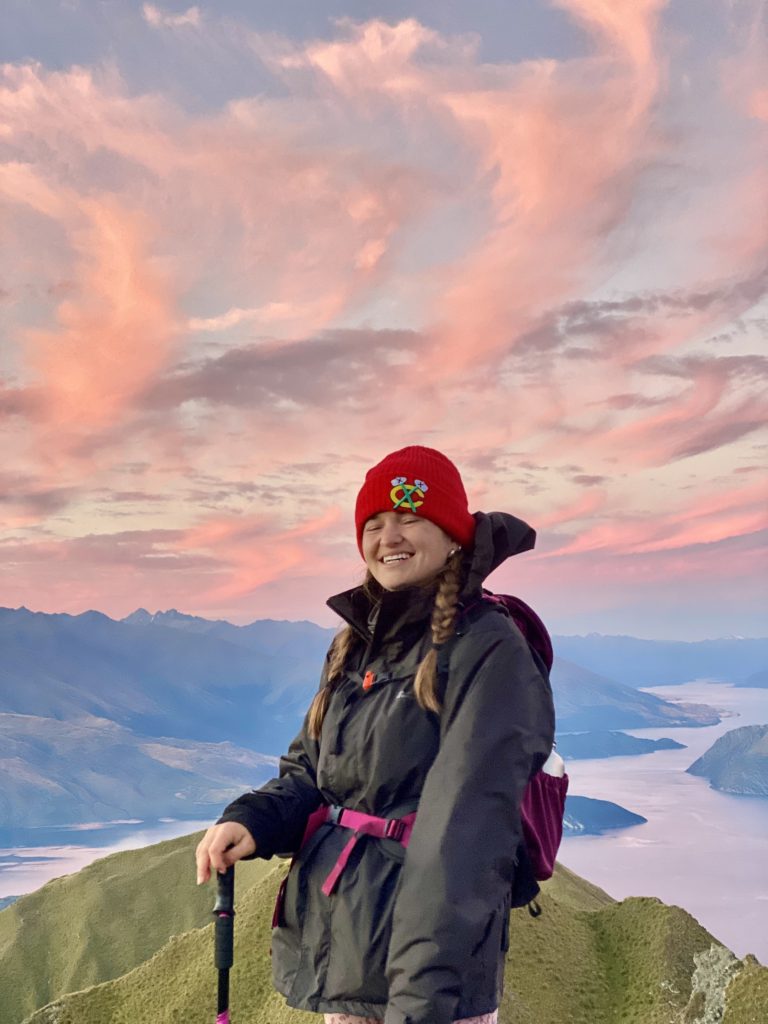 Niki stands on top of Mt Roy, Wanaka, New Zealand