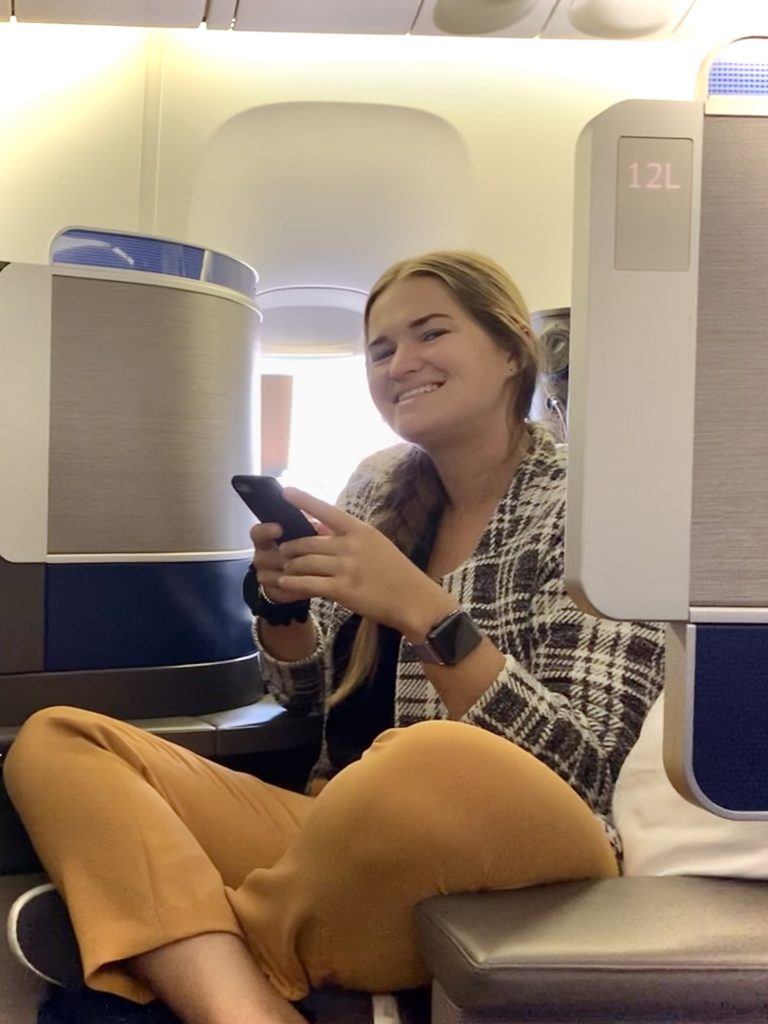 Is business class worth it? Niki sits in a United Airlines Polaris business class seat.