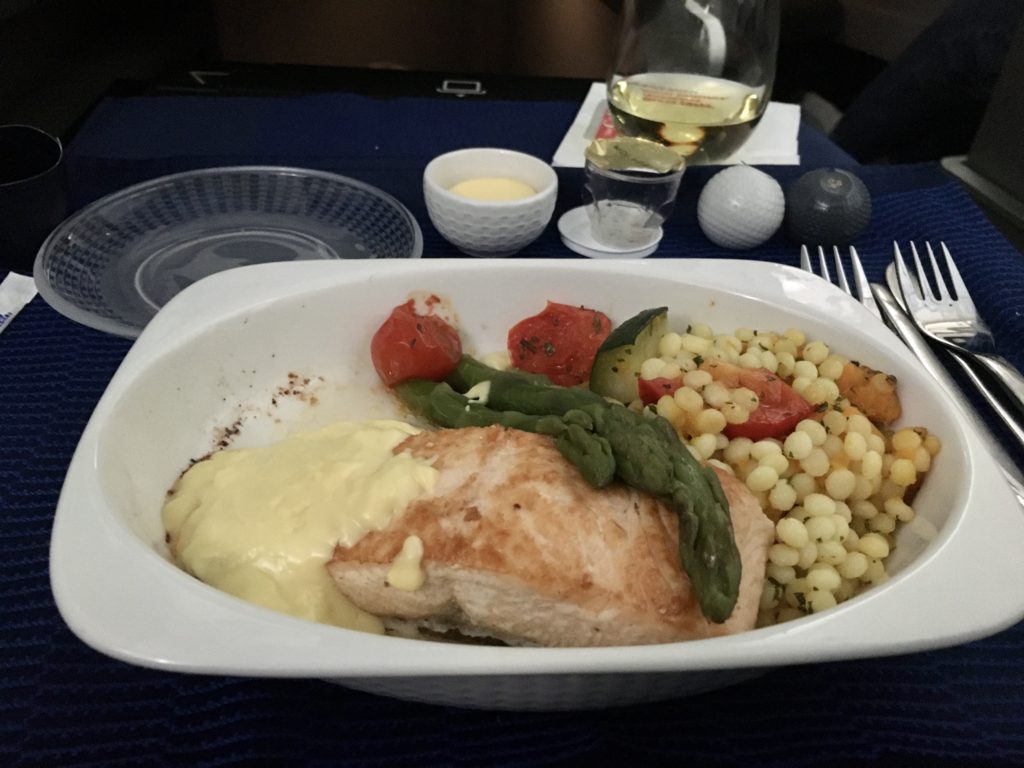 Is business class worth it? Business class dinner meal: salmon, couscous, and vegetables