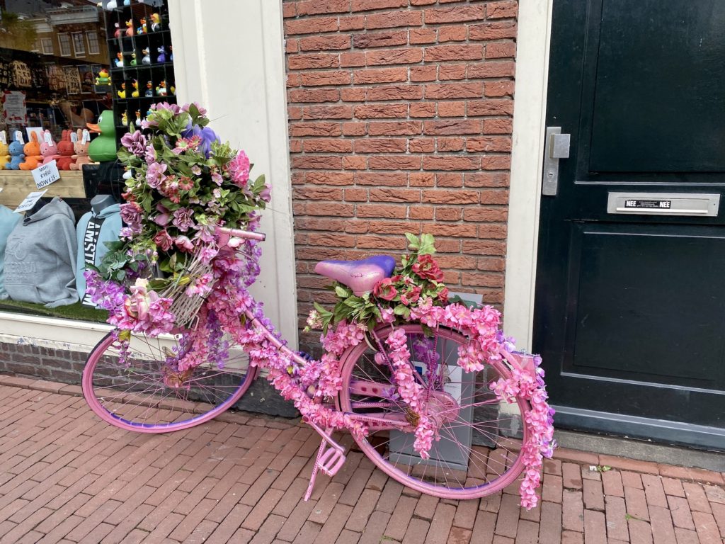 pink bike covered in flowers, the netherlands