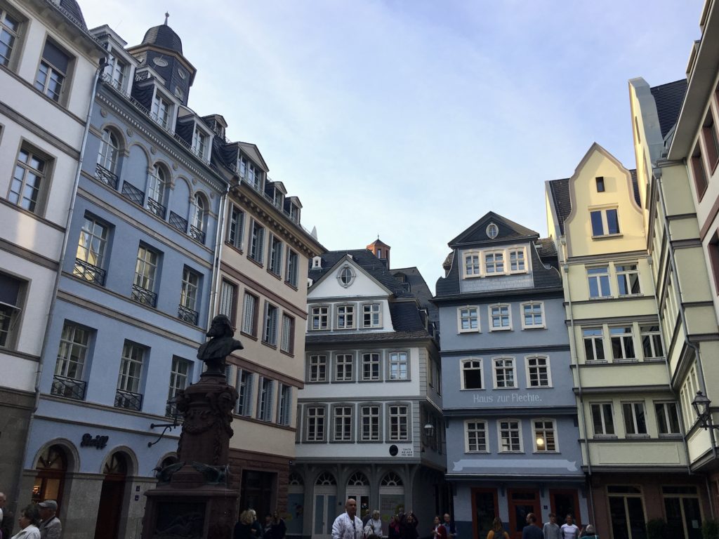 One day in Frankfurt: Colorful buildings in a town square with a statue