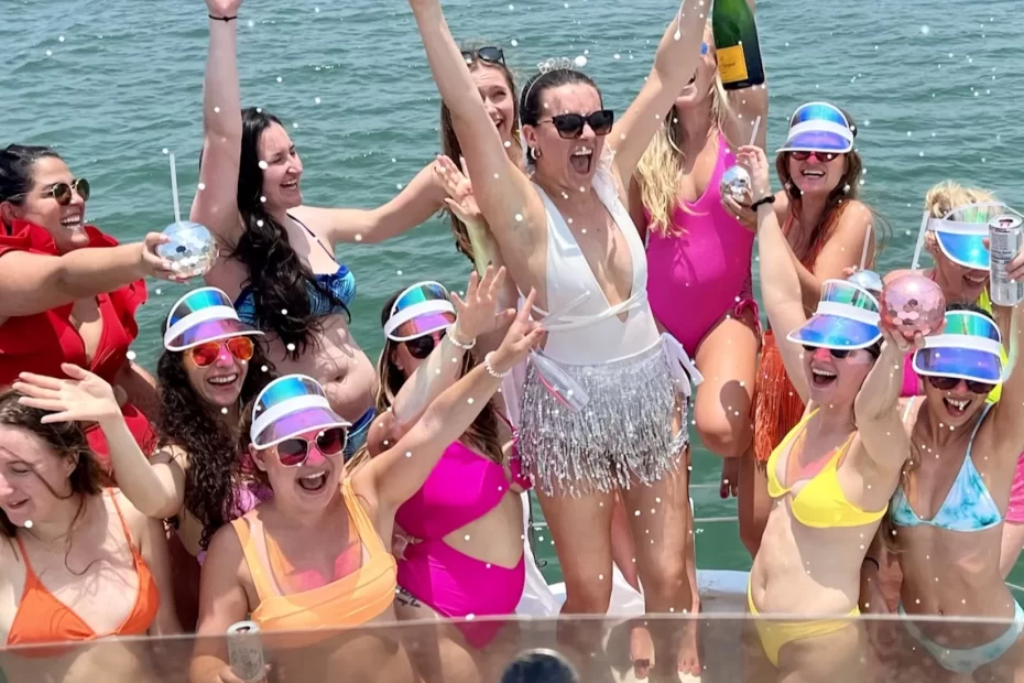 Miami girls trip: 11 girls in neon bikinis on a boat in Miami, Florida