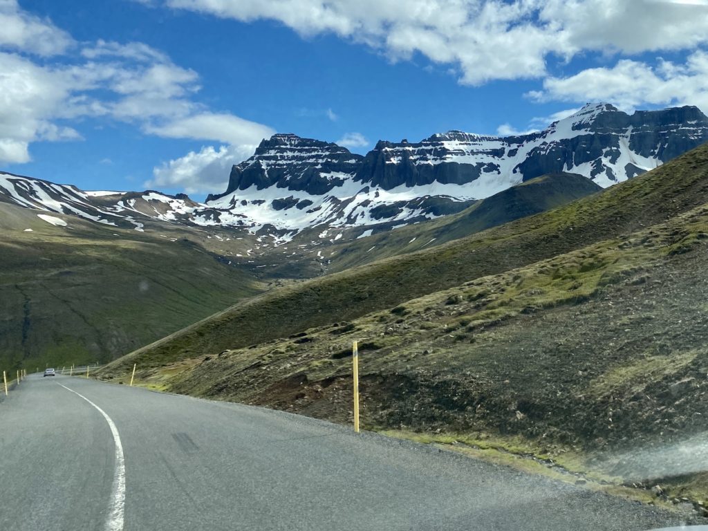 Paved road with mountains