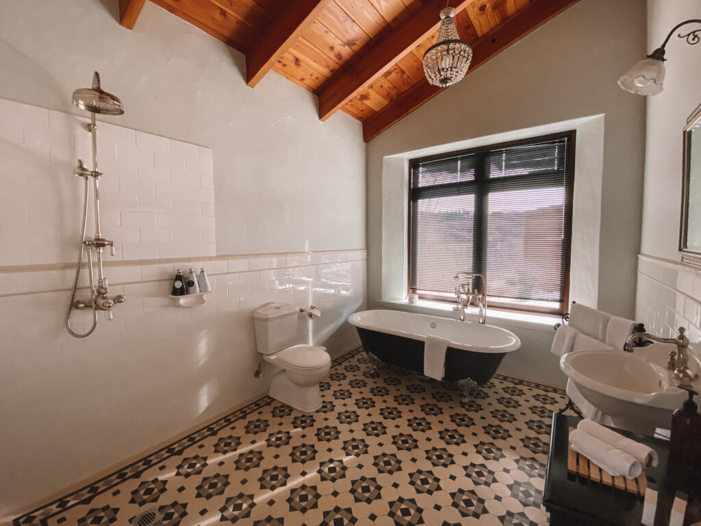 Fancy bathroom with shower, toilet, sink, and bathtub, South Island, New Zealand