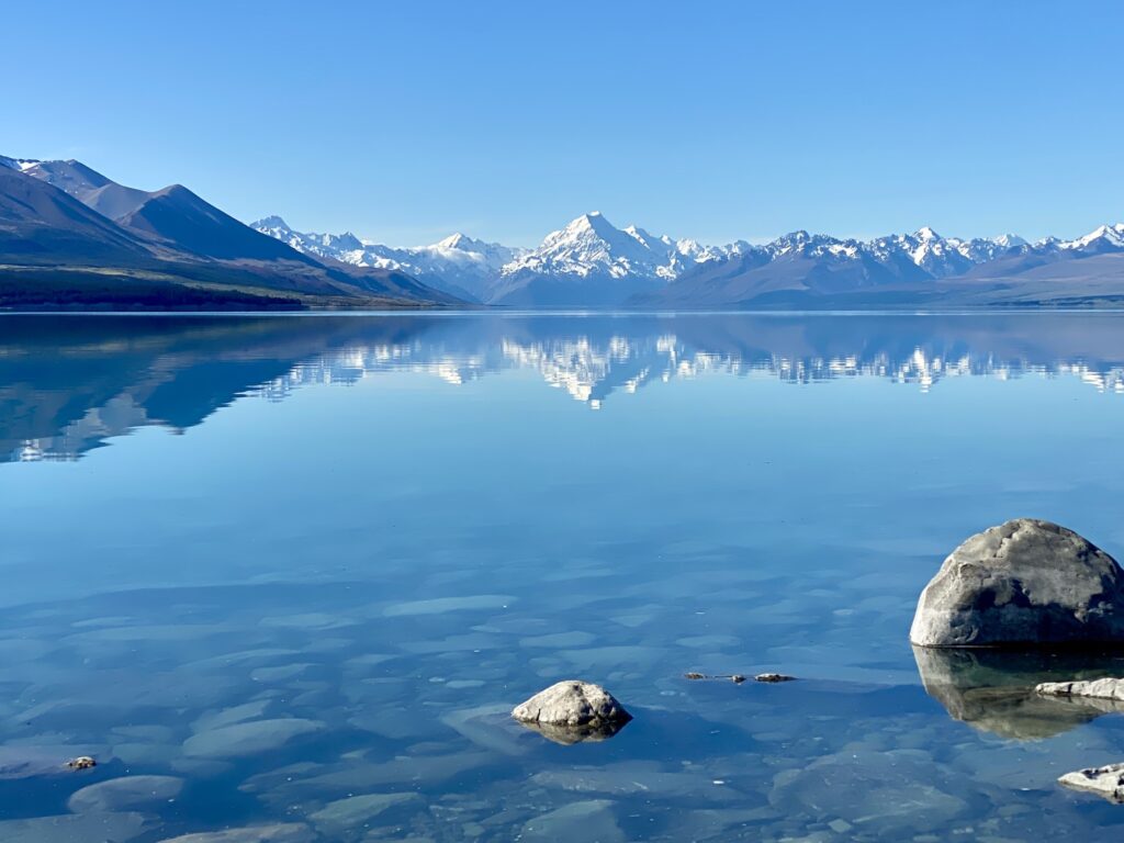 Christchurch to Queenstown road trip itinerary: Lake Pukaki with a view of Aoraki/Mt Cook and the Southern Alps, New Zealand