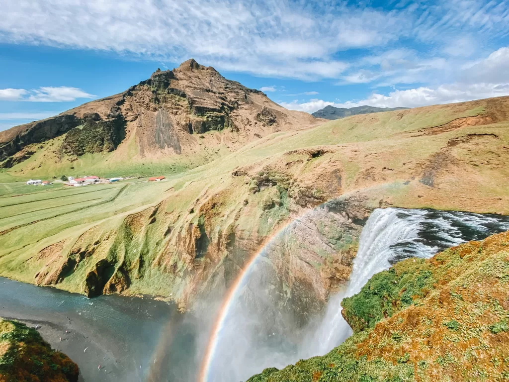 Iceland in June: Rainbow over a waterfall in southern Iceland
