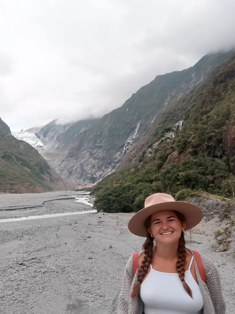Best day hikes South Island New Zealand: Niki poses on the Franz Josef Glacier Walk, West Coast
