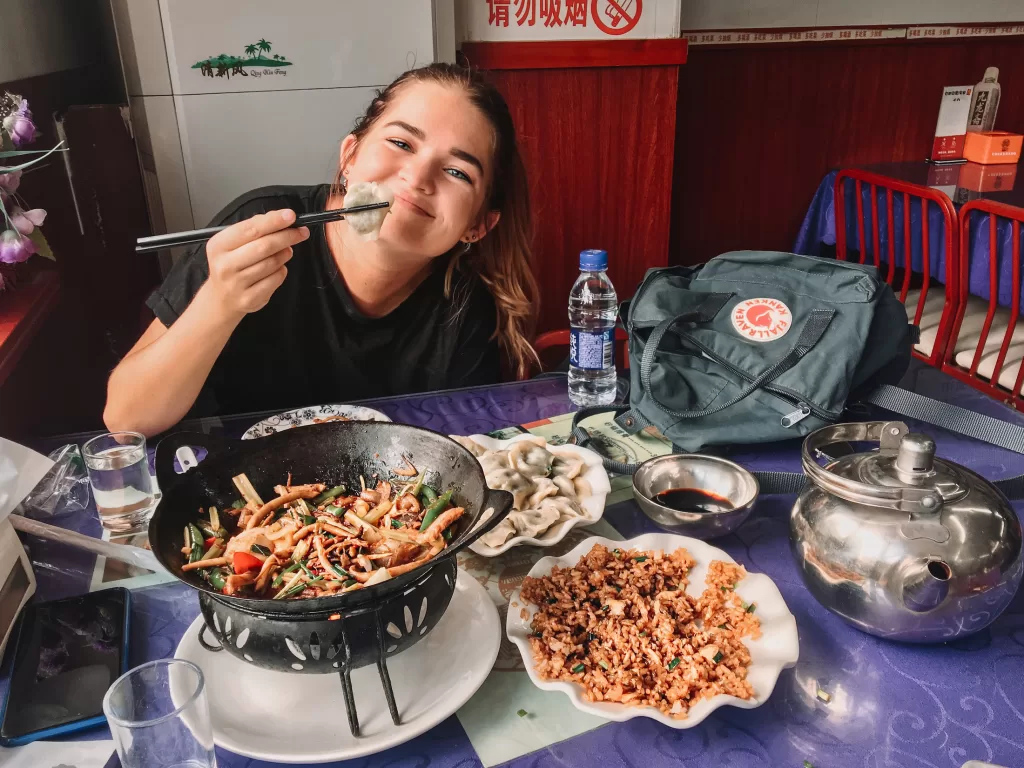 travel in your 20s: Niki eating food in Beijing, China