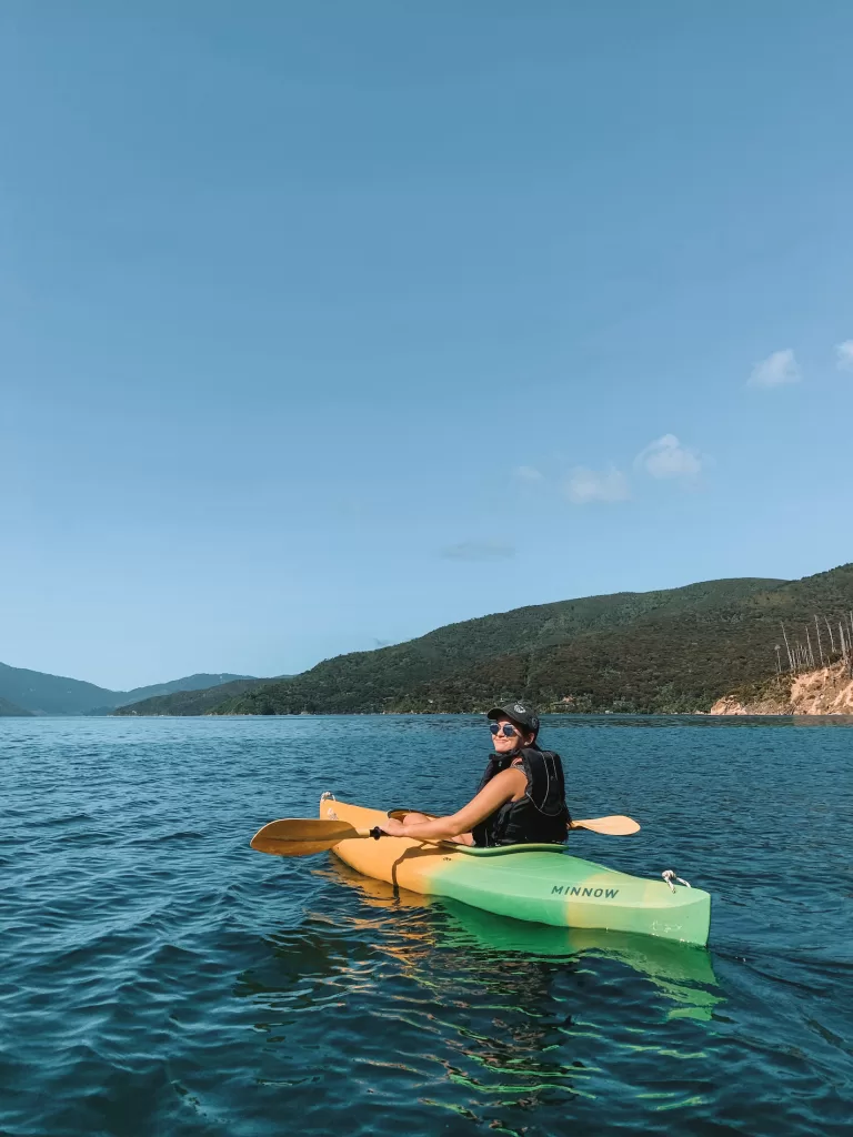travel in your 20s: Niki kayaking the Marlborough Sounds, South Island, New Zealand