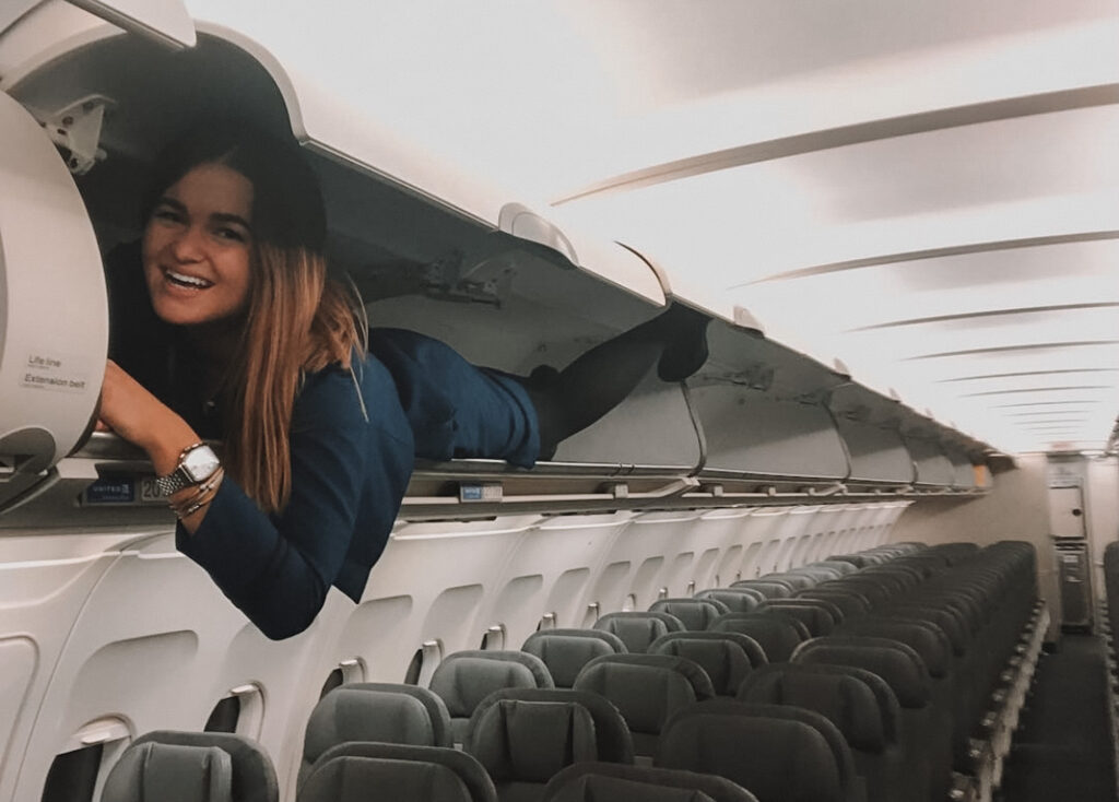Flight attendant quotes: Niki in an overhead bin on an airplane